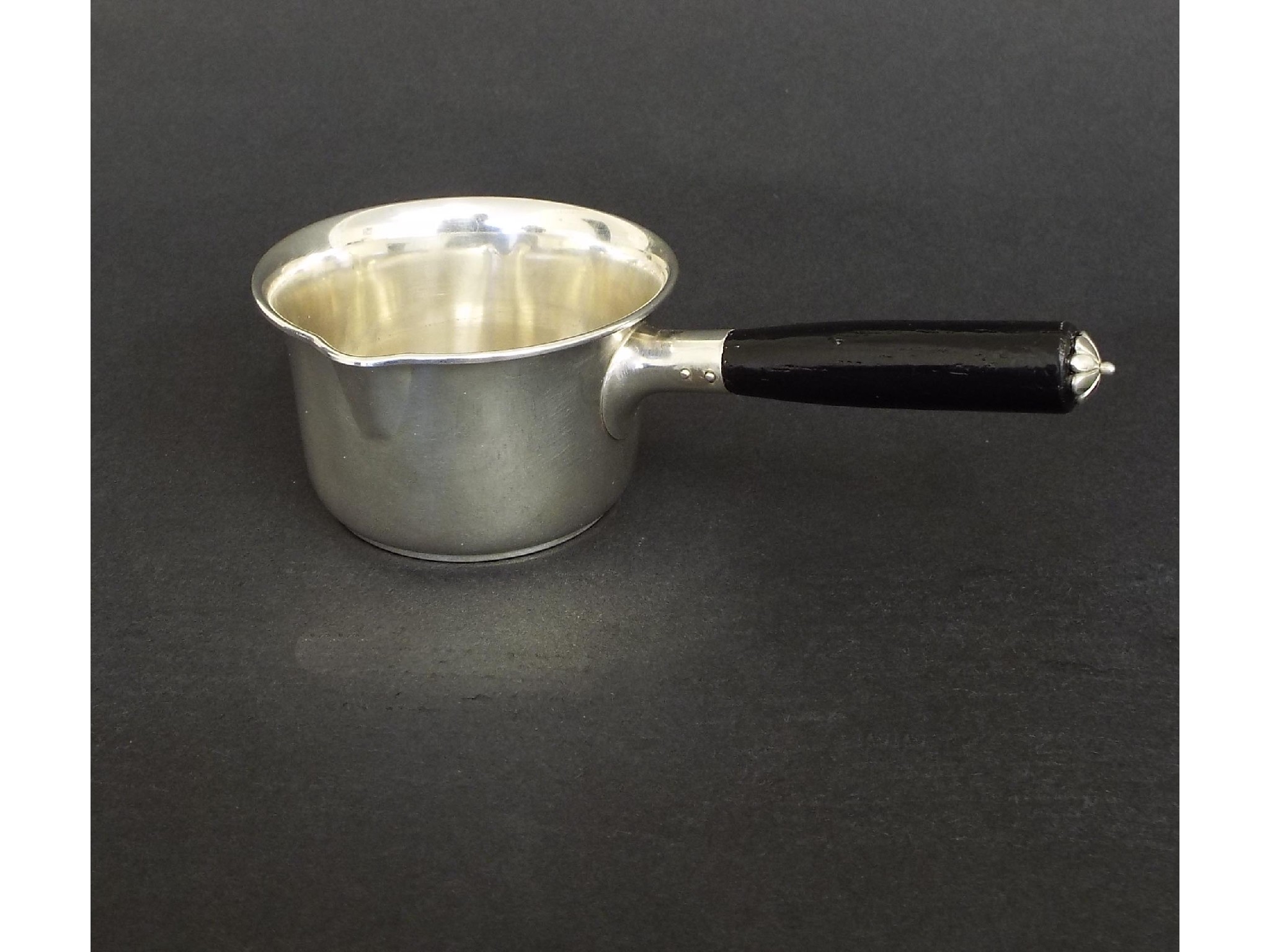 Appraisal: Danish silver creamer with a single ebonised handle maker Carl