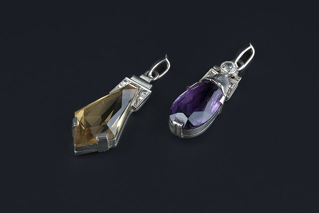 Appraisal: Two diamond and gem set pendants the first set with