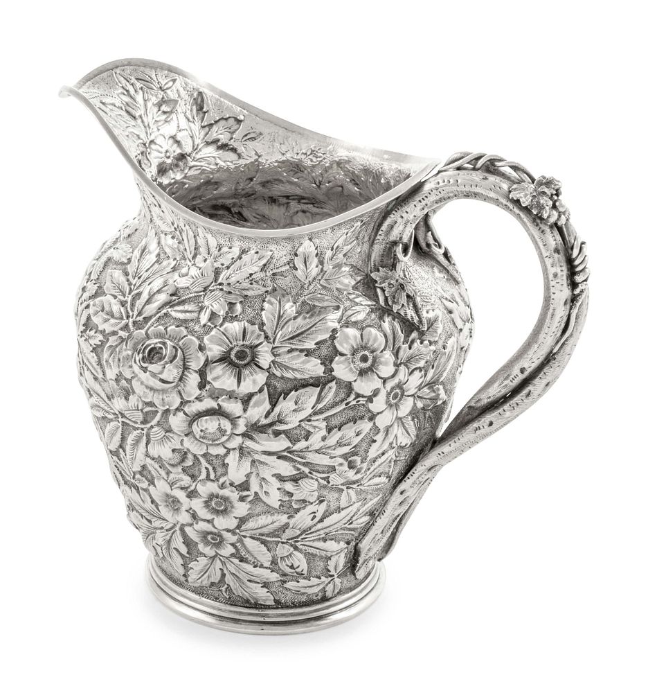 Appraisal: An American Silver Repousse Pitcher An American Silver Repousse Pitcher