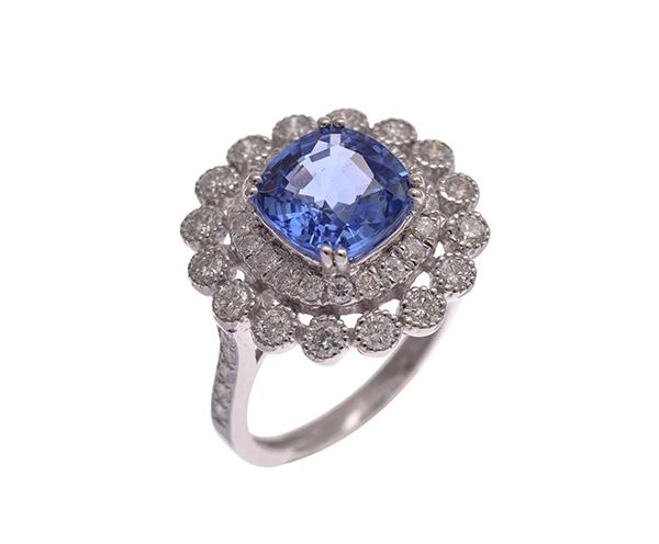 Appraisal: A SAPPHIRE AND DIAMOND CLUSTER RING Centrally set with a