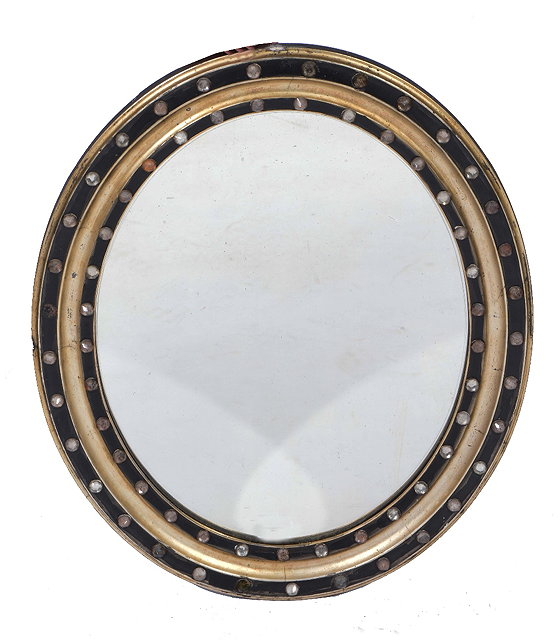 Appraisal: Irish oval ebonised and silvered mirrorearly th Century with glass