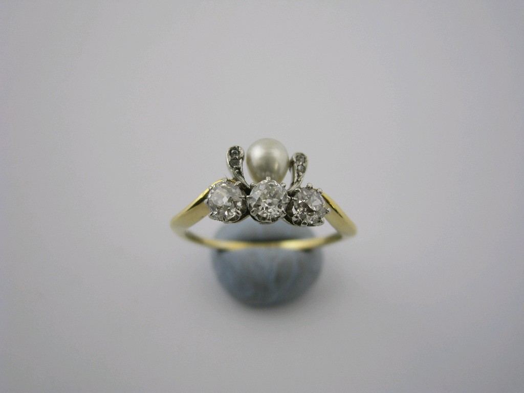 Appraisal: A Diamond and Pearl Ring the three old-cut diamonds claw-set