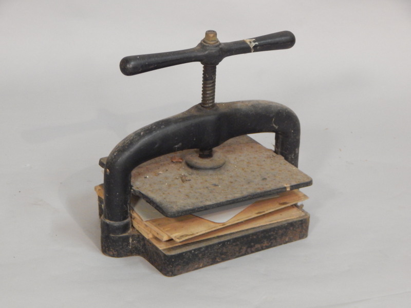 Appraisal: A cast iron book press makers label but indistinct