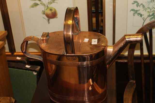 Appraisal: A TH CENTURY COPPER WATERING CAN of oval form with