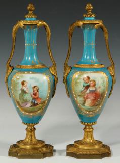 Appraisal: A PAIR C SEVRES-TYPE ORMOLU-MOUNTED PORCELAIN URNS A pair of