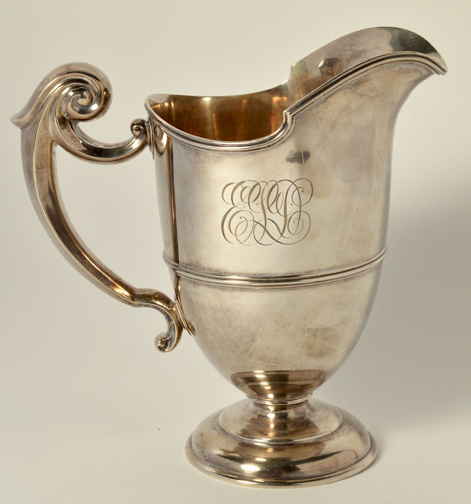 Appraisal: Sterling Silver Pitcher Sterling silver pitcher with ornamental scrolled handle