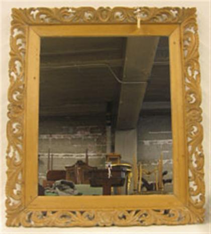 Appraisal: Continental carved pine wall mirror The rectangular mirror plate enclosed