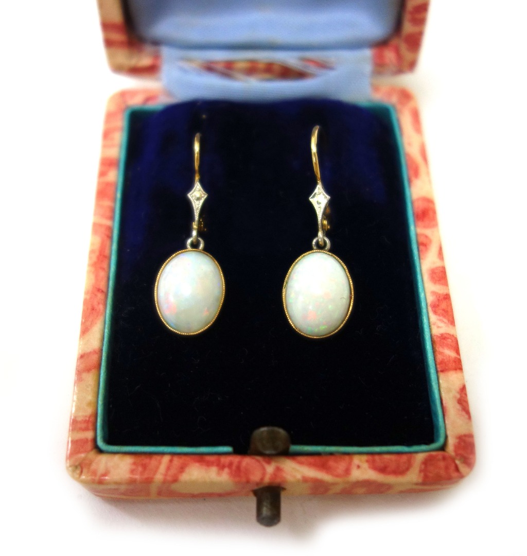 Appraisal: A pair of Edwardian gold and opal pendent earrings each