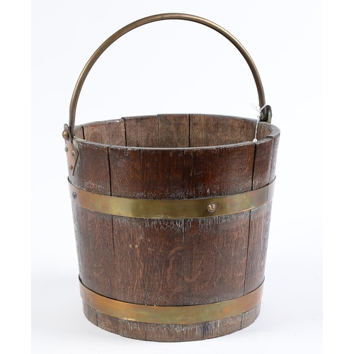 Appraisal: A brass bound oak coal bucket with brass handle early