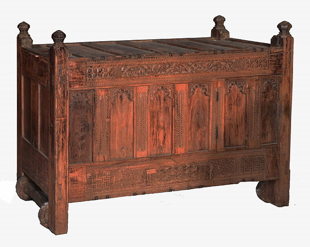 Appraisal: AN ANTIQUE INDIAN RAJASTHAN CARVED WOODEN CHEST with turned finials