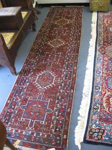 Appraisal: Heriz Persian Handmade Runner geometric medallions red field ' ''