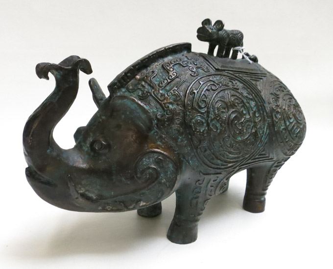 Appraisal: CHINESE BRONZE DECORATIVE WINE VESSEL stylized elephant figure with relief