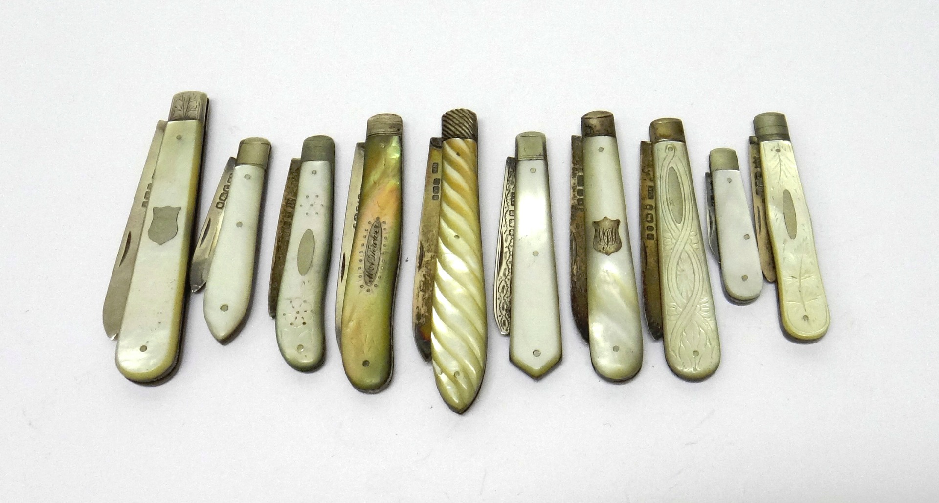 Appraisal: Ten silver bladed mother of pearl folding fruit knives in