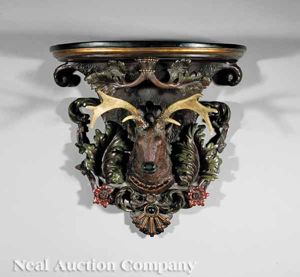 Appraisal: A Pair of Black Forest-Style Carved Elk Head Wall Brackets