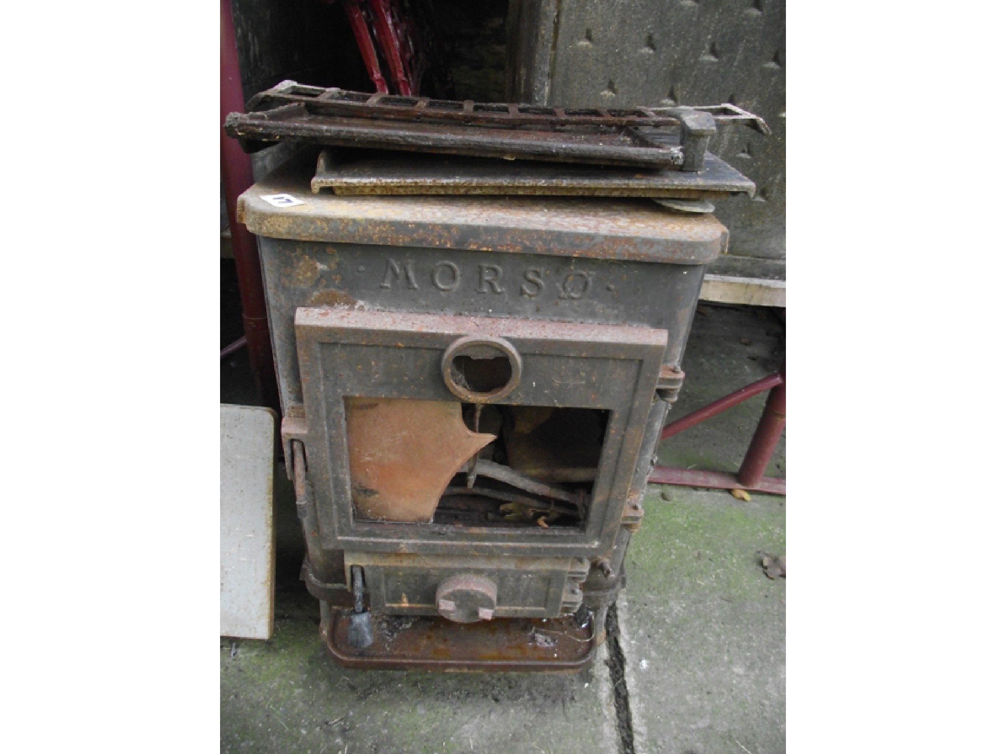 Appraisal: A Morso cast iron stove with decorative raised relief squirrel