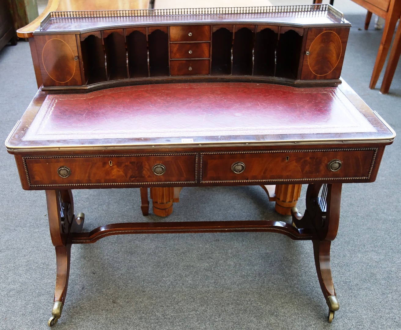 Appraisal: A Regency style writing desk the fitted concave super structure