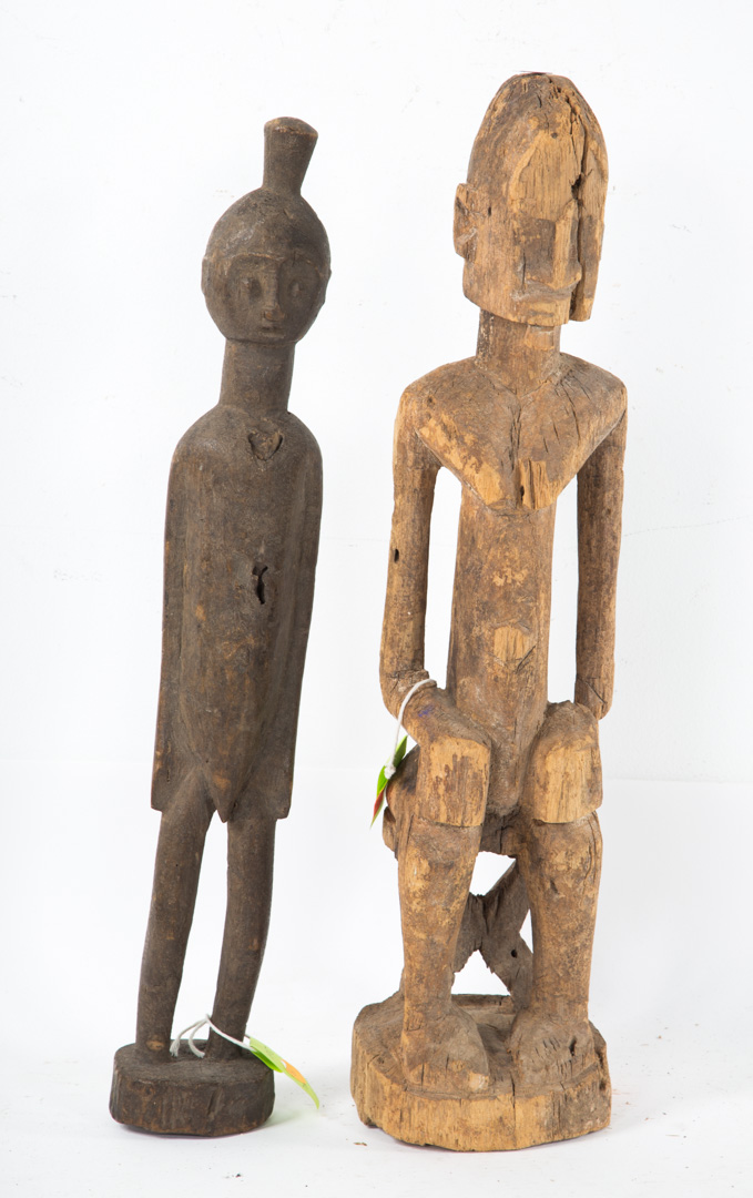 Appraisal: Two African carved wood figures Senufo ancestor figure in H