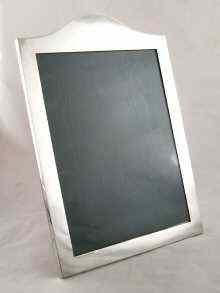 Appraisal: A large Victorian silver photo frame hallmarked London with oak