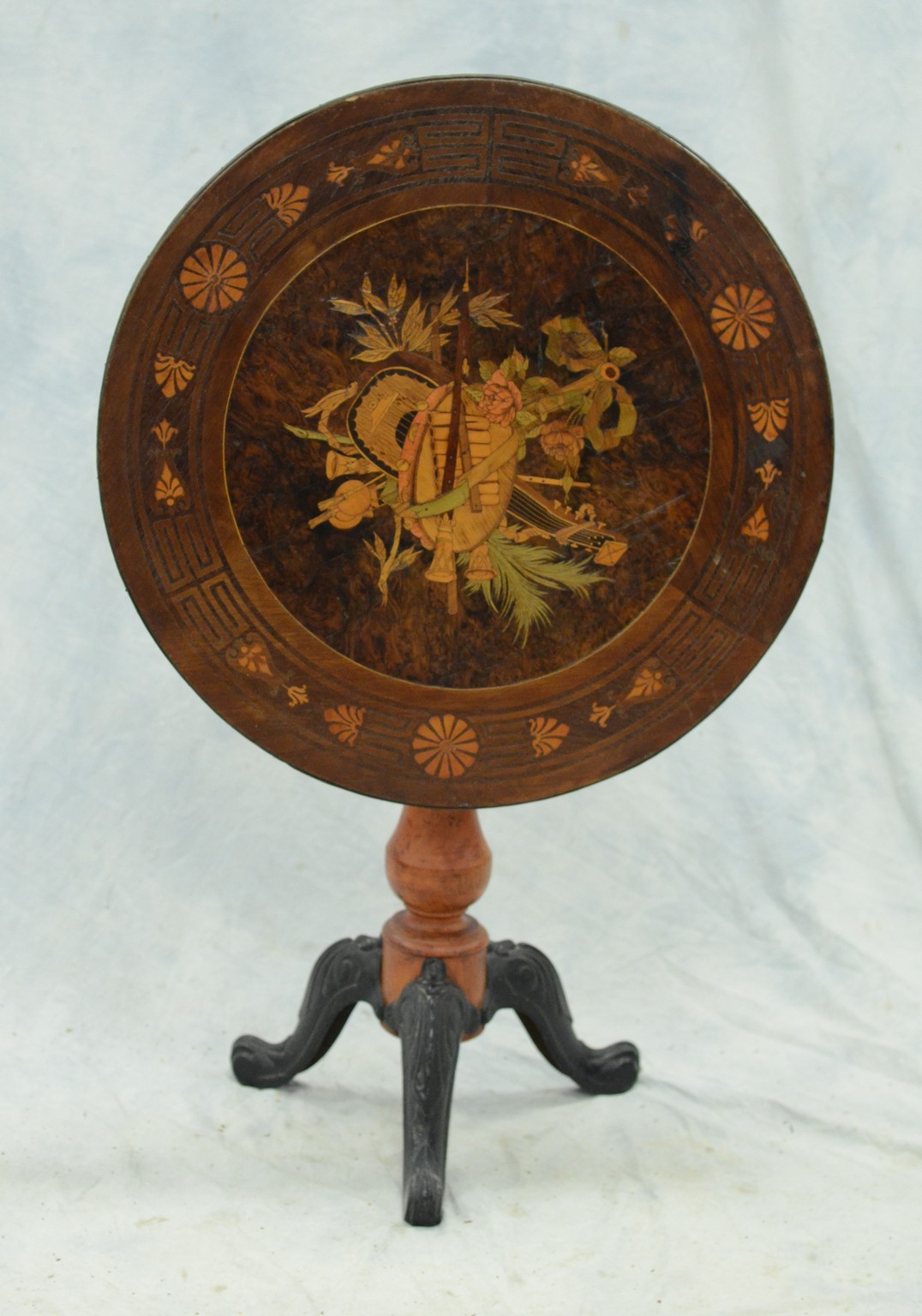 Appraisal: Round marquetry inlaid tilt top table the top with burl