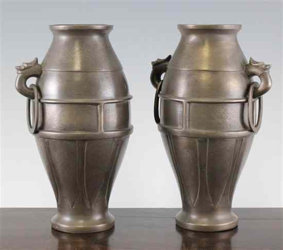 Appraisal: A pair of Chinese bronze and silver inlaid ovoid vases