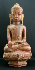 Appraisal: A Burmese carved wood terracotta painted and gilt figure of