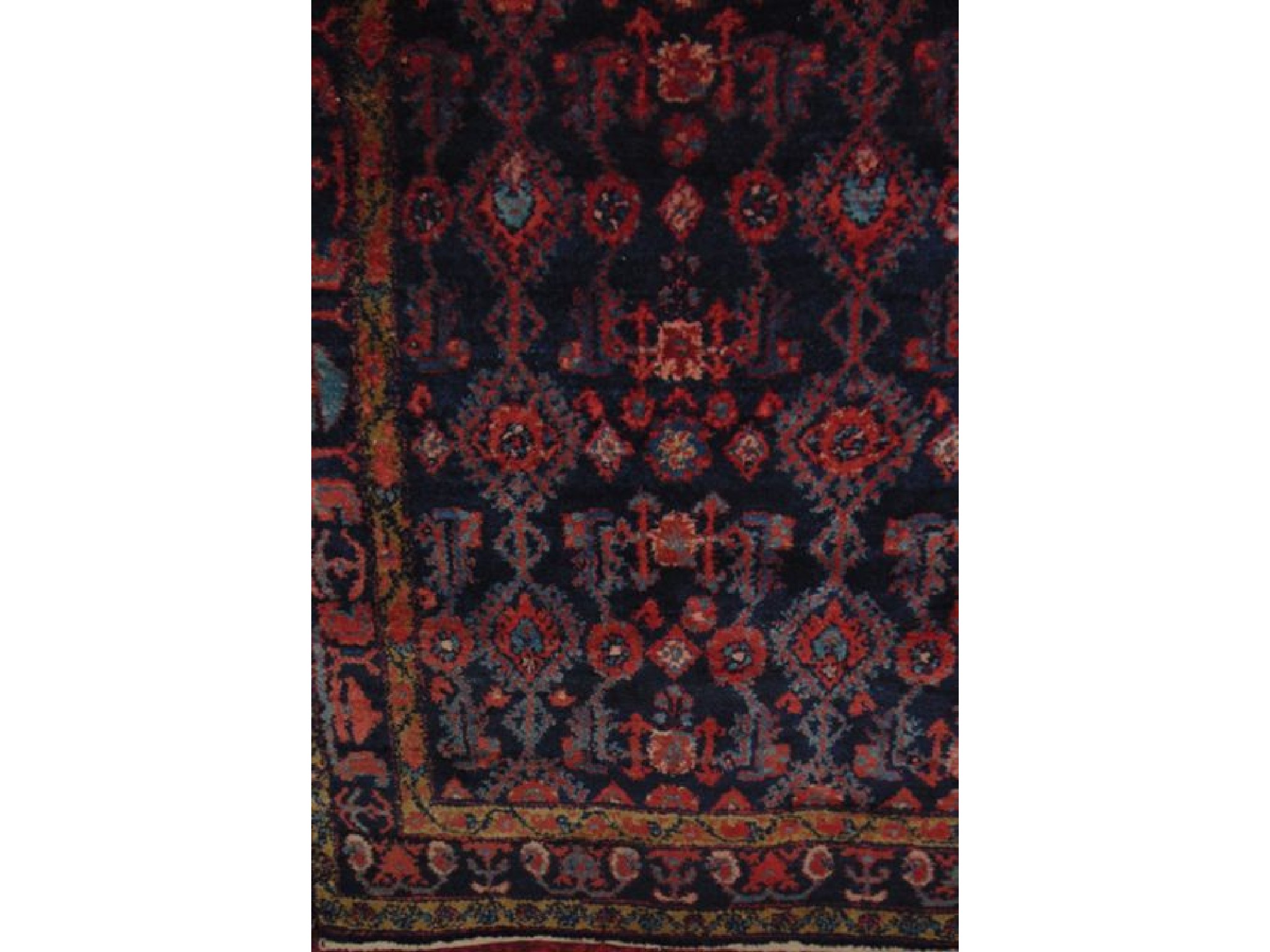 Appraisal: A Persian style coarse wool carpet with dark blue field