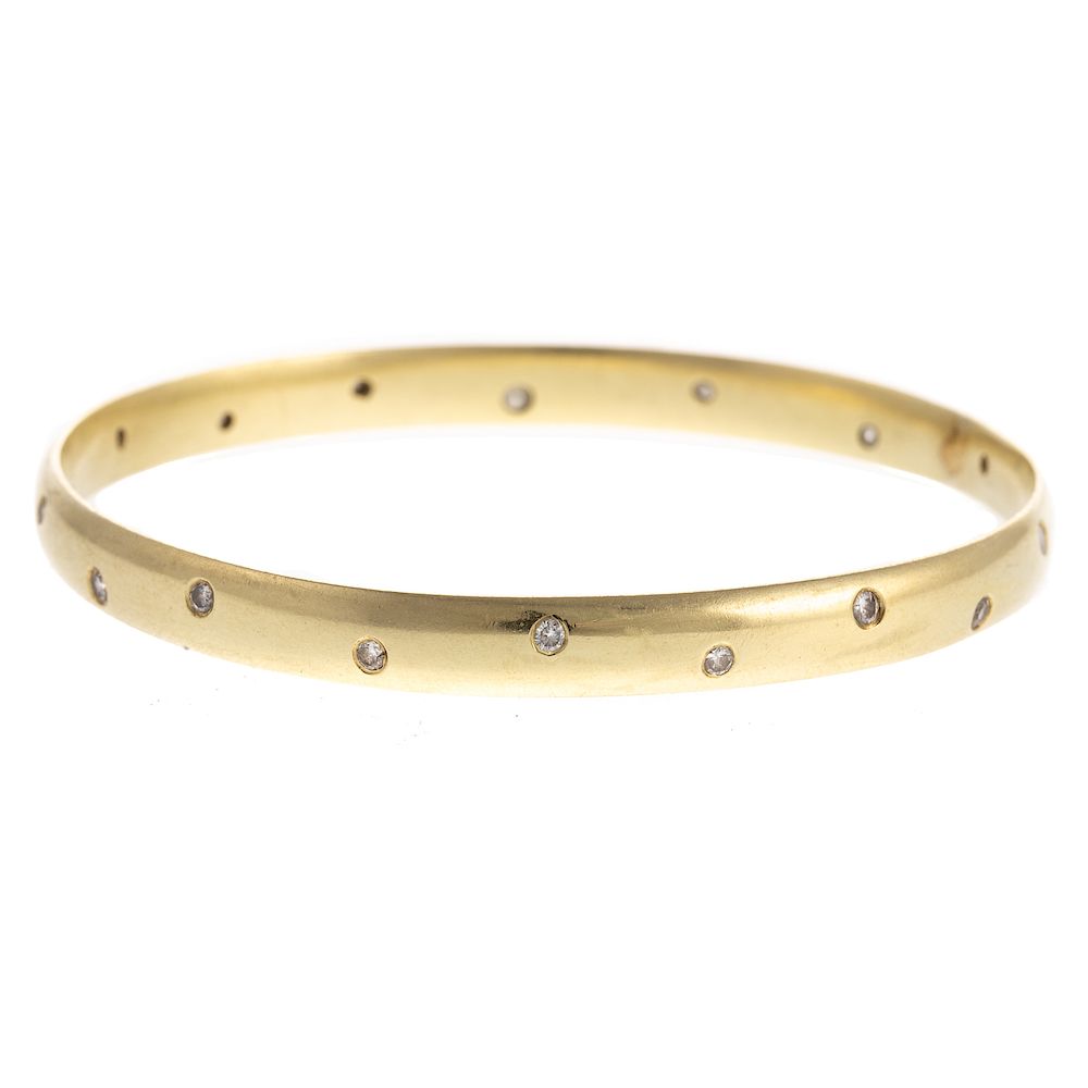 Appraisal: A Ladies K Yellow Gold Bangle with Diamonds K yellow