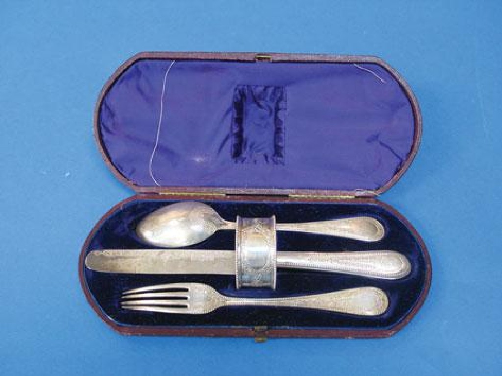 Appraisal: A VICTORIAN CHRISTENING SET comprising knife fork spoon and serviette