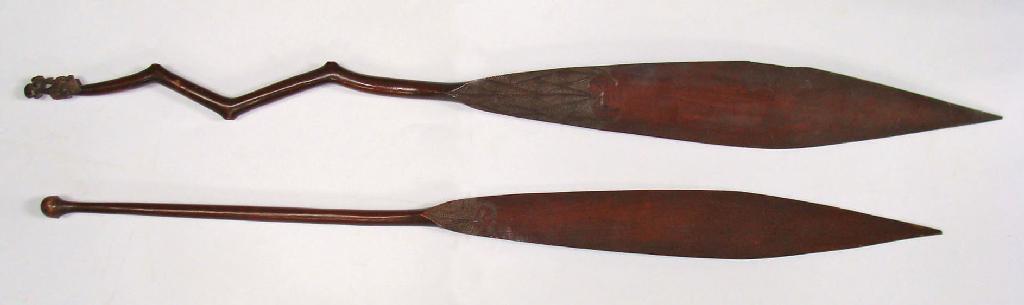 Appraisal: TWO SOUTH SEA ISLAND ORNAMENTAL PADDLES one with a straight