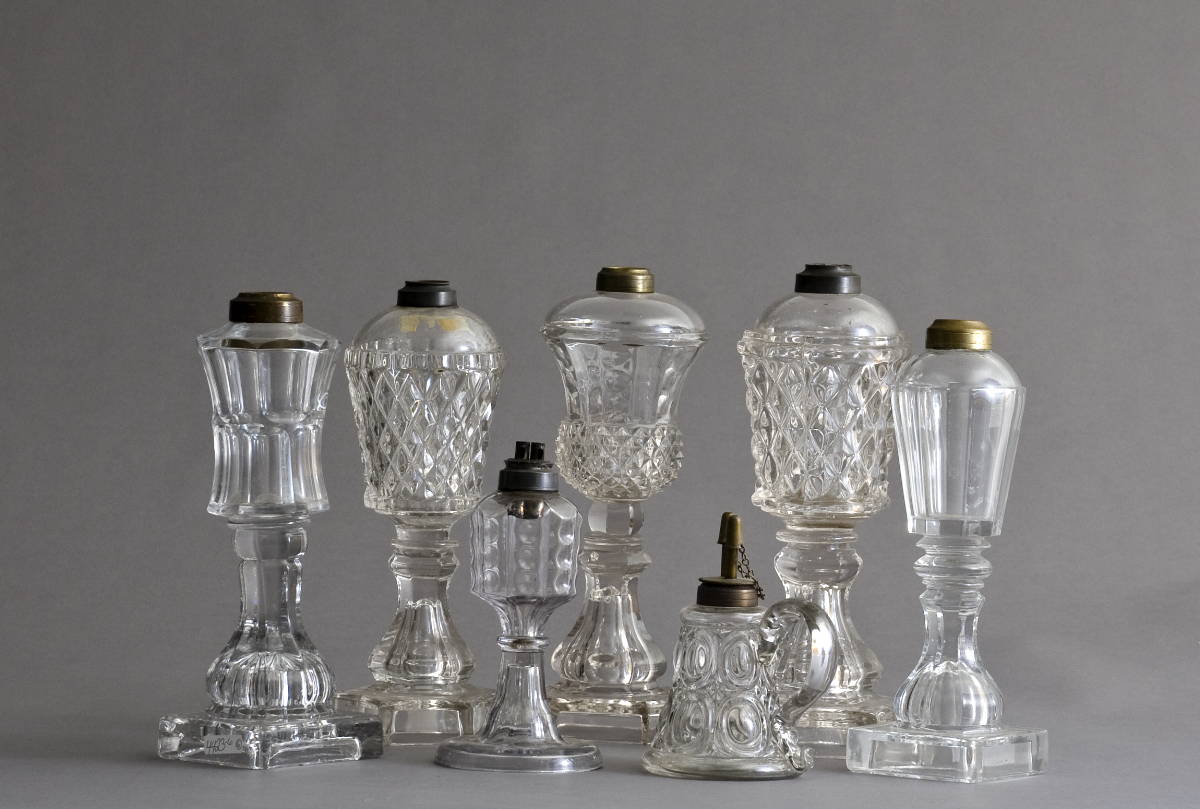 Appraisal: SEVEN PRESSED GLASS WHALE OIL LAMPS Height of tallest inches