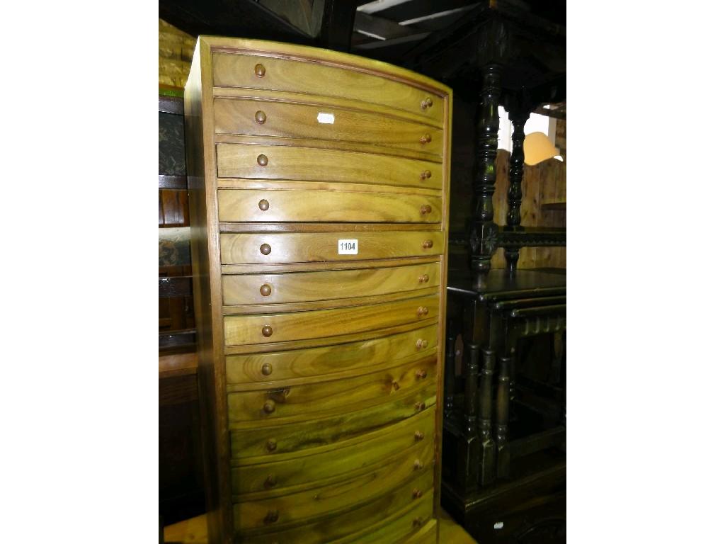 Appraisal: A hardwood free standing bow fronted specimen chest fitted with