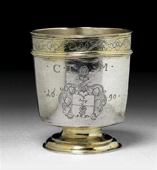 Appraisal: FOOTED BEAKER Engraved Parcel-gilt Smooth walls over retracted round foot