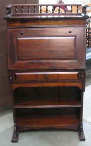 Appraisal: MAHOGANY FALL-FRONT WRITING DESK with spindle gallery over slant fall