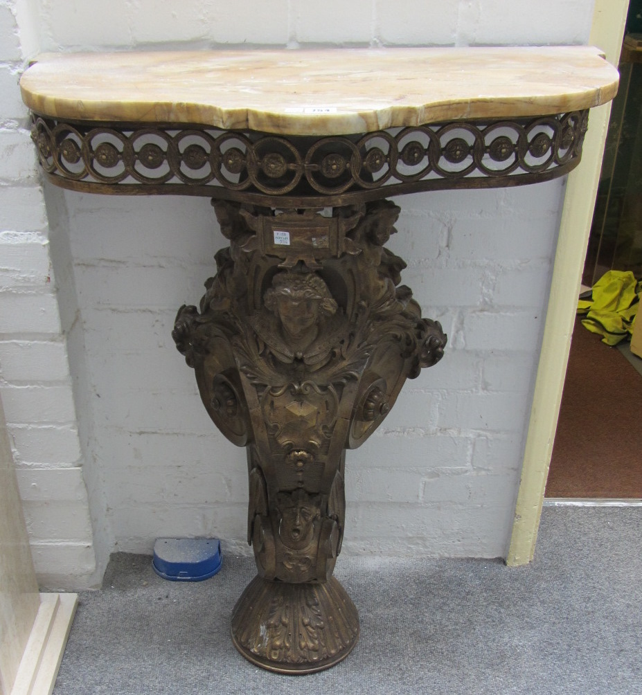 Appraisal: A Renaissance Revival style console table the shaped marble top