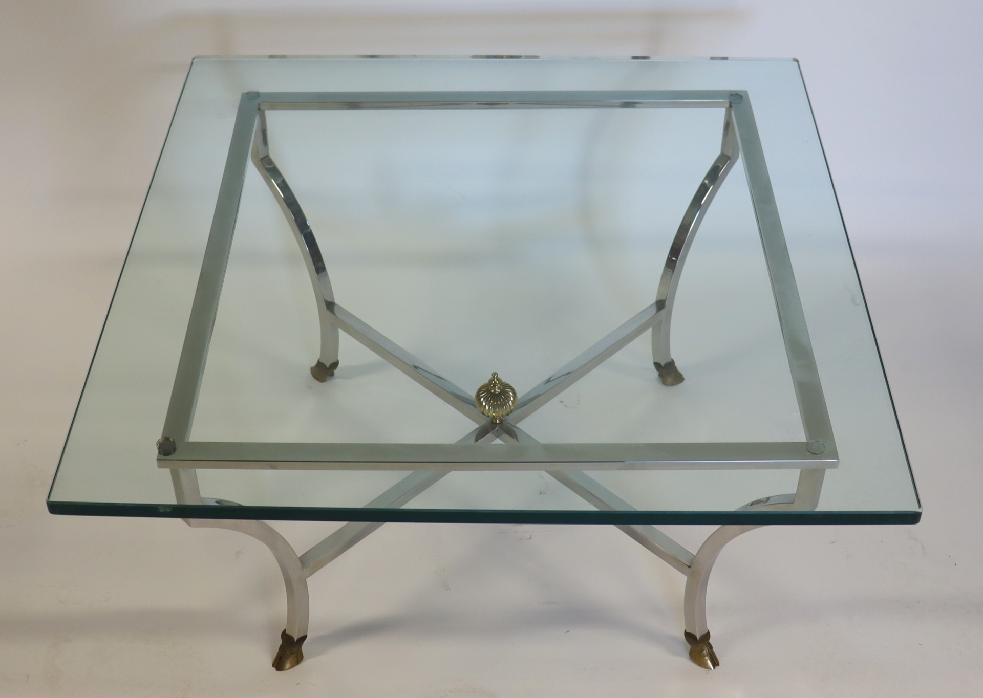 Appraisal: VINTAGE STEEL AND BRASS COFFEE TABLE Great quality with hoof