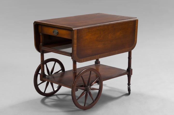 Appraisal: Regency-Style Banded Mahogany Tea Cart the top with two drop