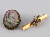 Appraisal: An oval brooch inset with a porcelain plaque of a