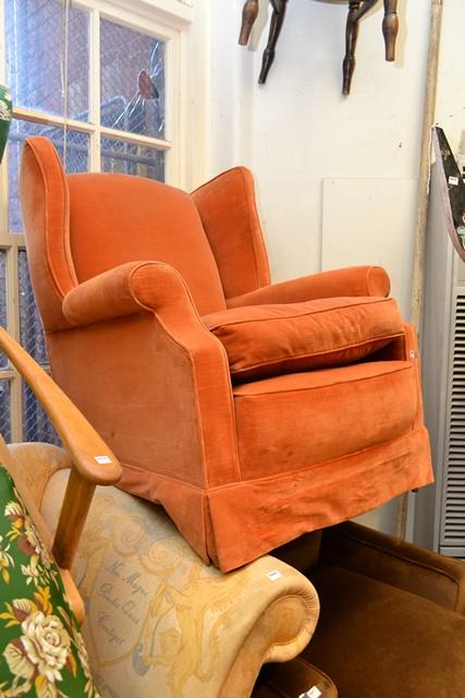 Appraisal: AN ORANGE UPHOLSTERED WING BACK ARM CHAIR