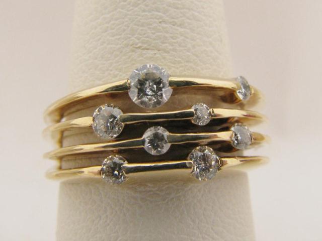 Appraisal: Lady's k yellow gold diamond band with cts total weight