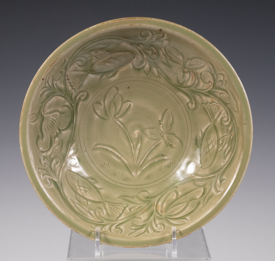 Appraisal: CHINESE CELADON BOWL Song Dynasty with carved floral decoration fluted