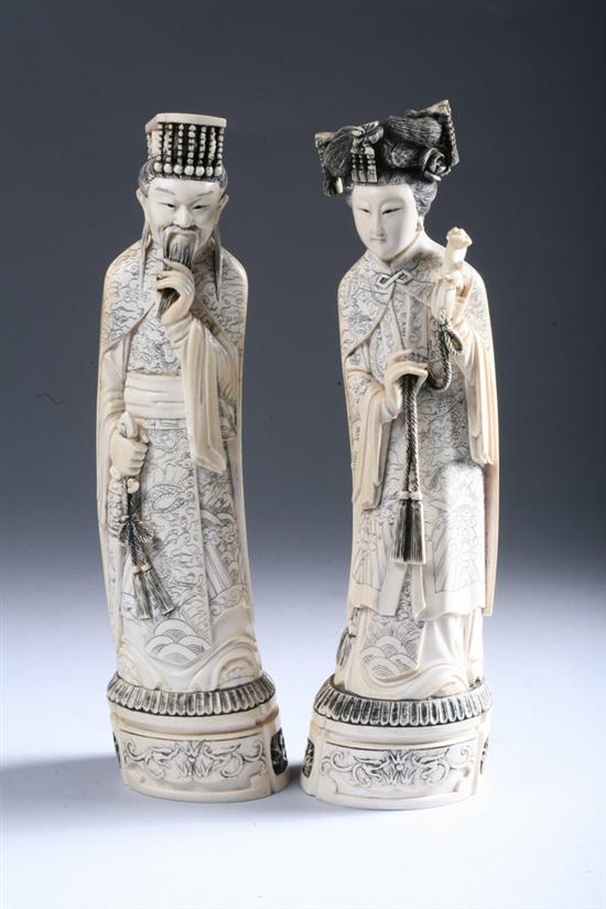 Appraisal: PAIR CHINESE IVORY FIGURES OF EMPEROR AND EMPRESS Qianlong incised