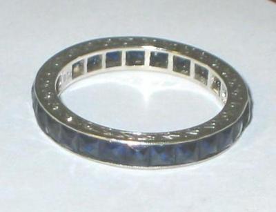 Appraisal: A SAPPHIRE ETERNITY RING of full hoop form set with