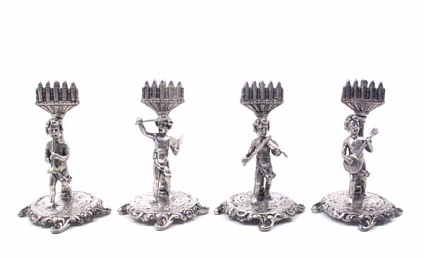 Appraisal: A set of eight figural sterling place card holders As