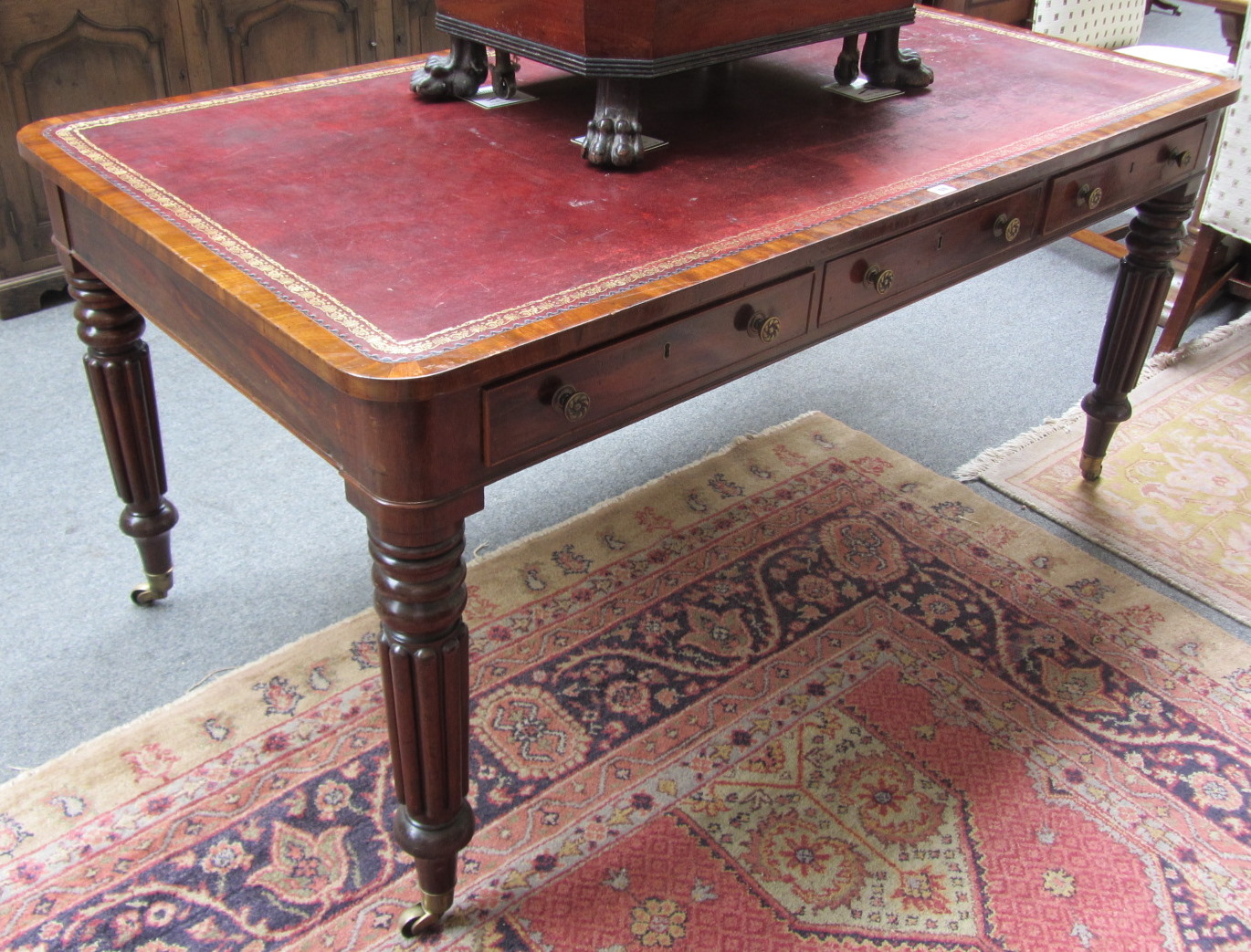 Appraisal: A William IV mahogany library table the rouge leather top