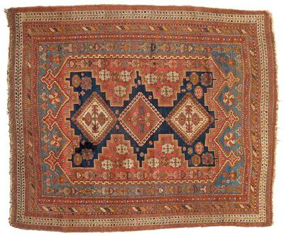 Appraisal: Caucasian rug three central medallions with hooked borders on blue