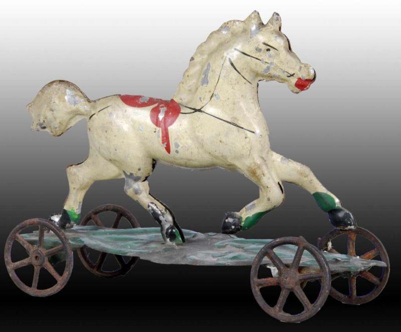 Appraisal: Hand-Painted American Tin Horse Platform Toy Description th century Probably