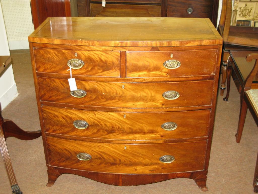 Appraisal: An early th Century bow fronted mahogany chest of two