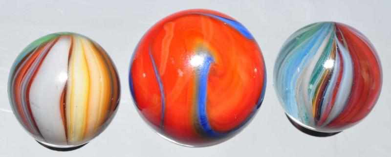 Appraisal: Lot of Akro Agate Marbles Description Two smaller marbles are