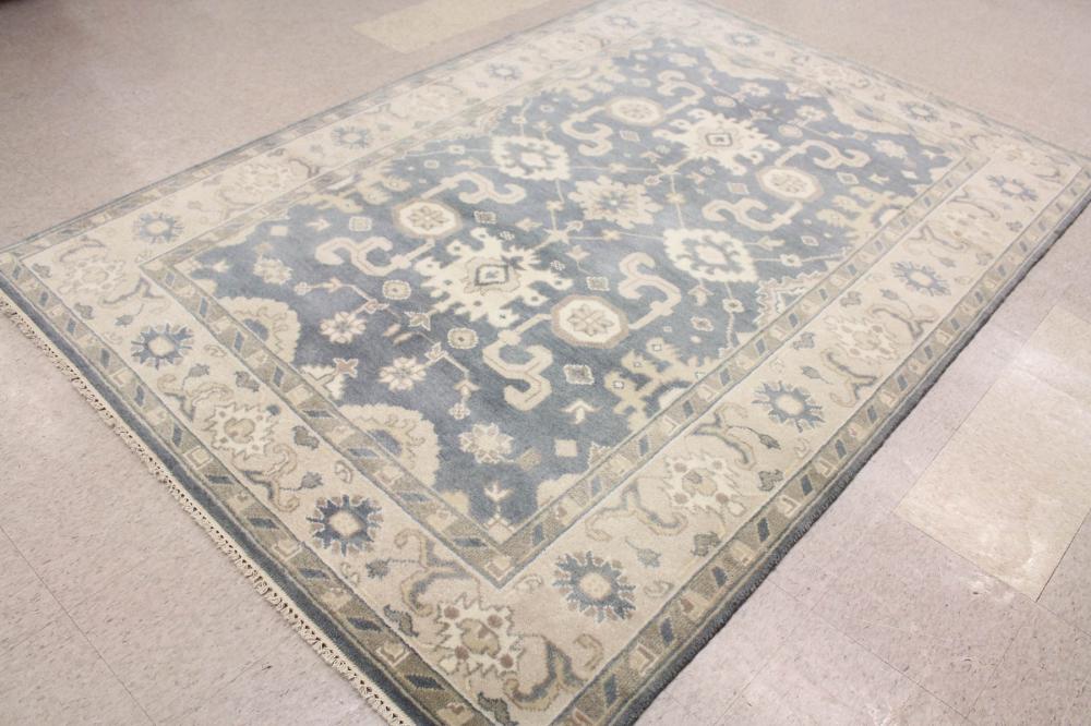 Appraisal: A CONTEMPORARY HAND KNOTTED ORIENTAL CARPET Indo-Persian cream and taupe