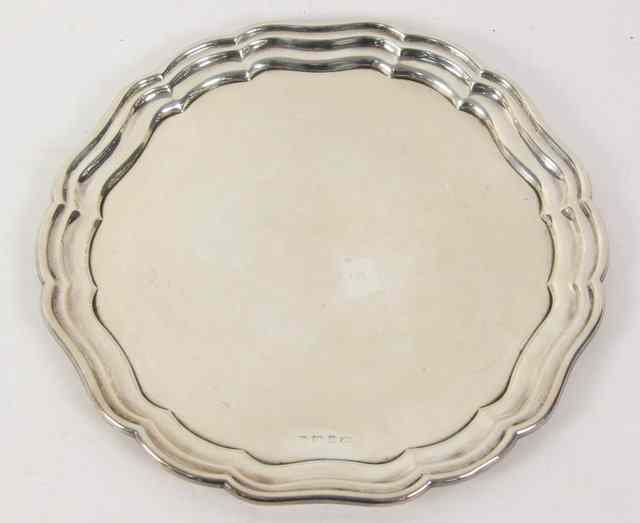 Appraisal: A silver dish Birmingham date letter rubbed of shaped outline